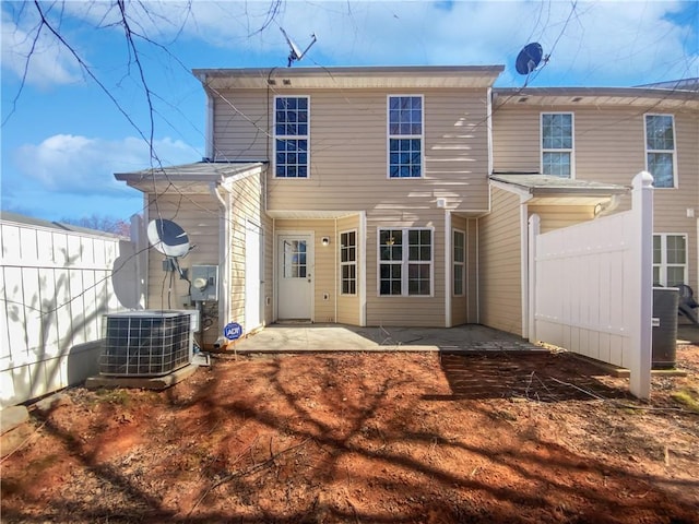 back of house with a patio, cooling unit, and fence