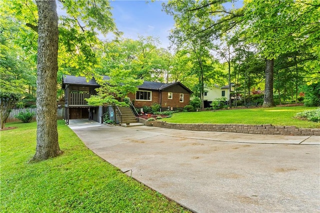 2511 Oak Ave, Tucker, GA 30084 - view of front of home featuring stairs, a front yard, concrete driveway, and brick siding