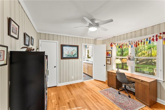 2511 Oak Ave, Tucker, GA 30084 - office area featuring crown molding, light wood finished floors, a ceiling fan, baseboards, and a sink
