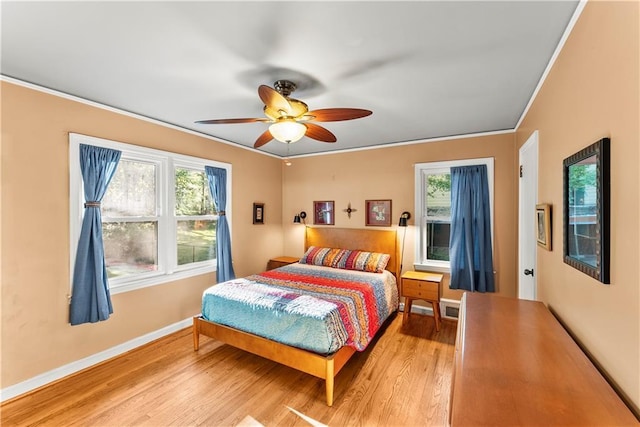 2511 Oak Ave, Tucker, GA 30084 - bedroom with light wood-style floors, baseboards, ornamental molding, and a ceiling fan