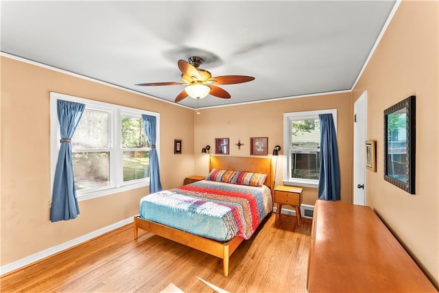 2511 Oak Ave, Tucker, GA 30084 - bedroom with light wood-style flooring, baseboards, ornamental molding, and a ceiling fan