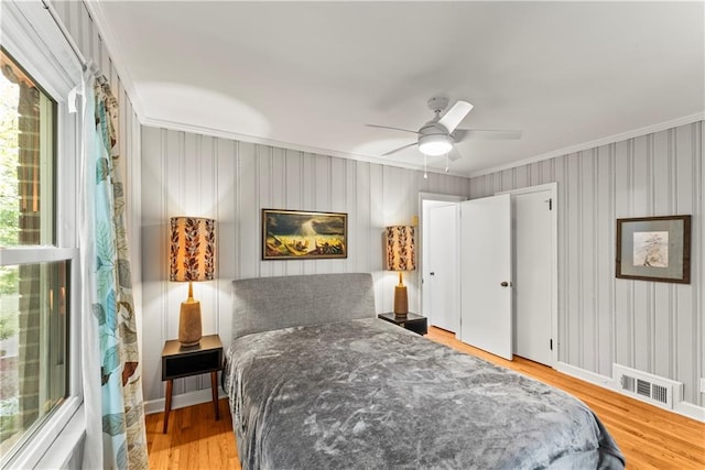 2511 Oak Ave, Tucker, GA 30084 - bedroom featuring crown molding, light wood-style floors, a ceiling fan, baseboards, and wallpapered walls