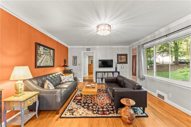 2511 Oak Ave, Tucker, GA 30084 - living room with a chandelier, wood finished floors, ornamental molding, and baseboards
