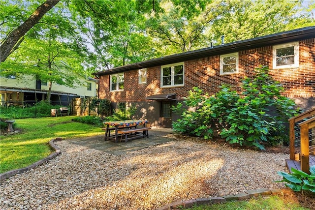 2511 Oak Ave, Tucker, GA 30084 - rear view of house featuring brick siding and a patio area
