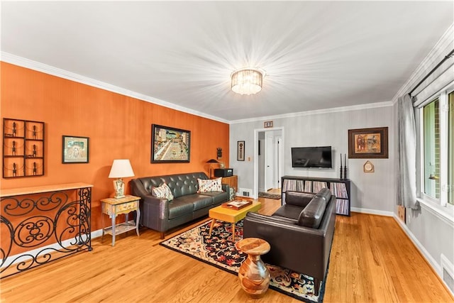 2511 Oak Ave, Tucker, GA 30084 - living area with crown molding, wood finished floors, plenty of natural light, and baseboards