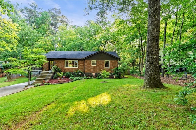 2511 Oak Ave, Tucker, GA 30084 - single story home featuring a front lawn, brick siding, and concrete driveway