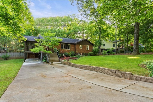 2511 Oak Ave, Tucker, GA 30084 - ranch-style home with concrete driveway, brick siding, and stairs