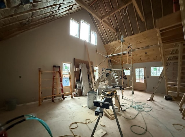 interior space featuring a towering ceiling