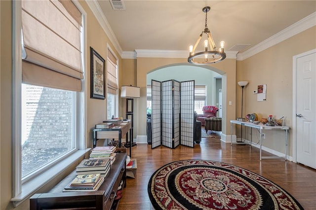 13943 Sunfish Bnd, Alpharetta, GA 30004 - foyer entrance with arched walkways, visible vents, wood finished floors, and a chandelier