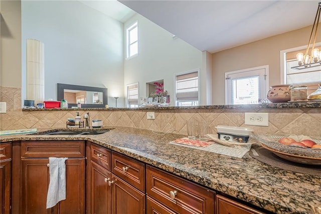 13943 Sunfish Bnd, Alpharetta, GA 30004 - kitchen featuring a healthy amount of sunlight and decorative backsplash
