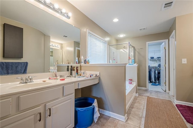 13943 Sunfish Bnd, Alpharetta, GA 30004 - full bath featuring visible vents, vanity, baseboards, a bath, and a stall shower