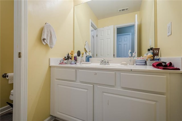 13943 Sunfish Bnd, Alpharetta, GA 30004 - bathroom with visible vents, toilet, and vanity