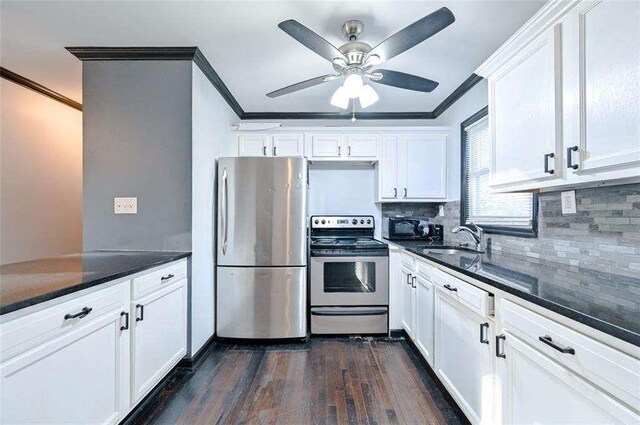 kitchen with crown molding, appliances with stainless steel finishes, sink, and white cabinets