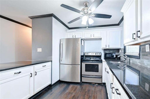 kitchen with white cabinetry, crown molding, and stainless steel appliances