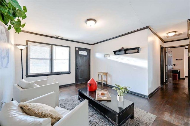 living room with dark wood-type flooring and ornamental molding