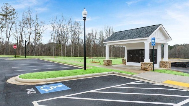 view of parking featuring mail area