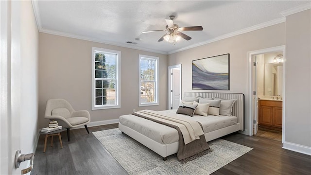 bedroom with dark hardwood / wood-style flooring, connected bathroom, crown molding, and ceiling fan