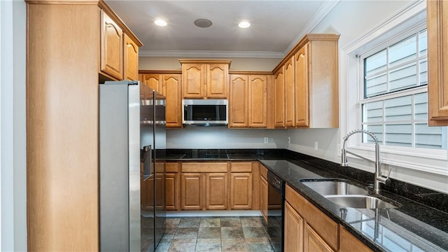 kitchen featuring sink, crown molding, dark stone counters, and appliances with stainless steel finishes