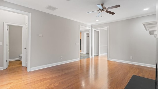 unfurnished bedroom featuring connected bathroom, ornamental molding, ceiling fan, and light wood-type flooring