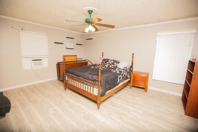 bedroom featuring cooling unit, ornamental molding, ceiling fan, and light hardwood / wood-style flooring