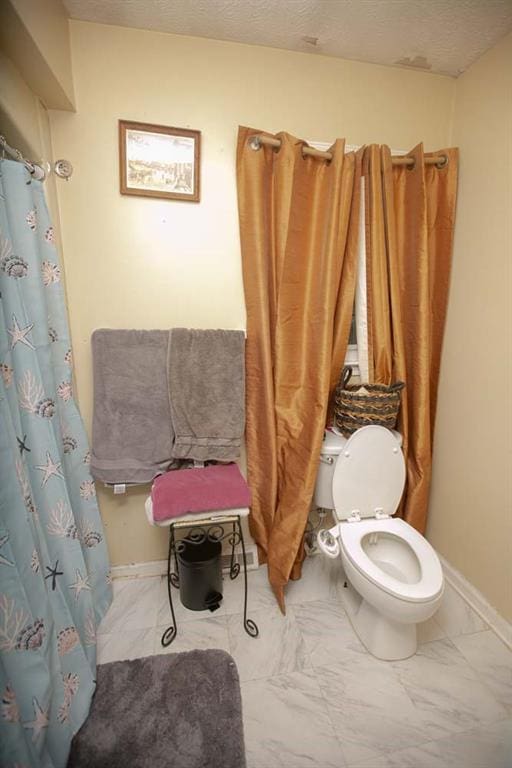 bathroom featuring toilet