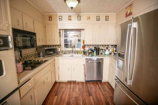 kitchen with white cabinetry, tasteful backsplash, a textured ceiling, black appliances, and sink