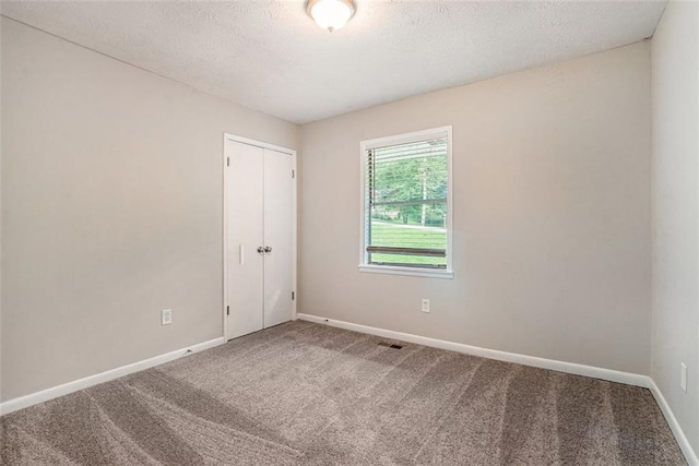 4442 Cedar Ridge Trl, Stone Mountain, GA 30083 - carpeted spare room featuring a textured ceiling and baseboards