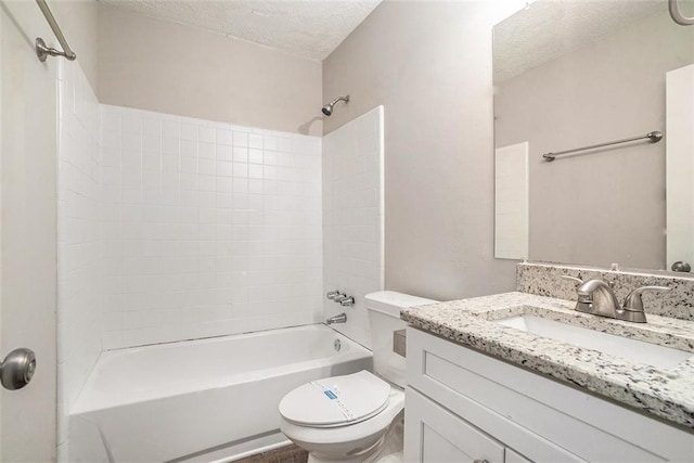 4442 Cedar Ridge Trl, Stone Mountain, GA 30083 - bathroom featuring a textured ceiling, vanity, and shower / tub combination