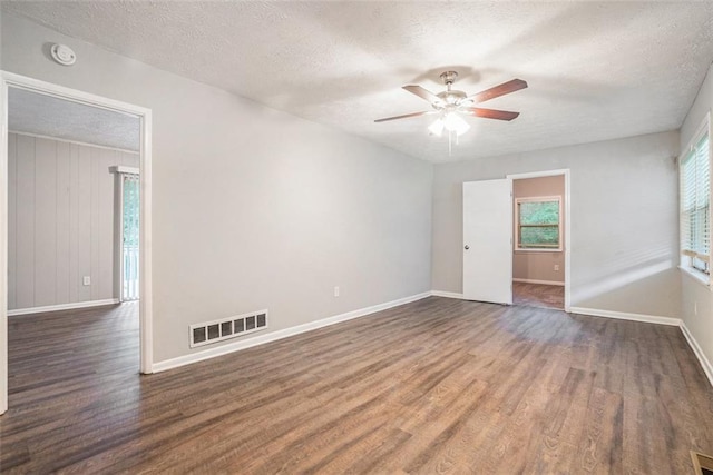 4442 Cedar Ridge Trl, Stone Mountain, GA 30083 - spare room with wood finished floors, a ceiling fan, a textured ceiling, and a smoke detector