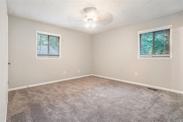 4442 Cedar Ridge Trl, Stone Mountain, GA 30083 - carpeted empty room with ceiling fan and a textured ceiling