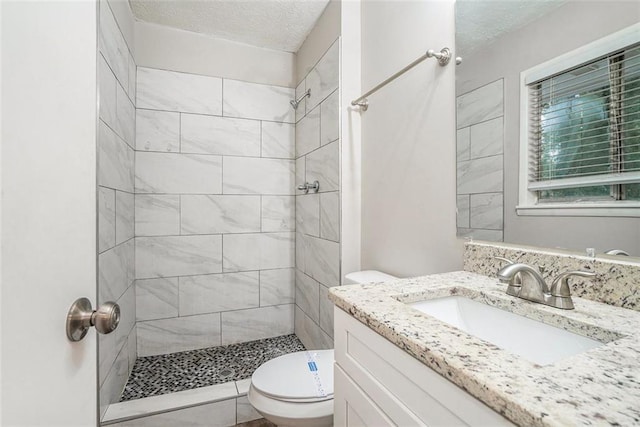 4442 Cedar Ridge Trl, Stone Mountain, GA 30083 - full bath with vanity, a tile shower, and a textured ceiling