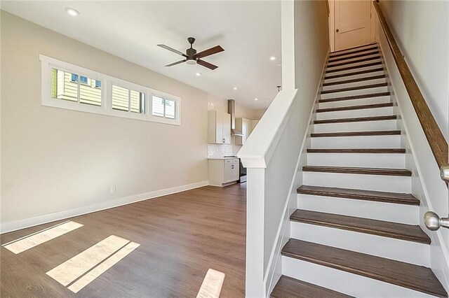 spare room featuring dark hardwood / wood-style floors and ceiling fan