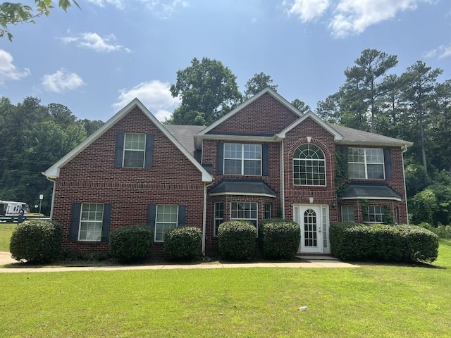 6157 Redtop Loop, Fairburn, GA 30213 - traditional-style home with brick siding and a front yard