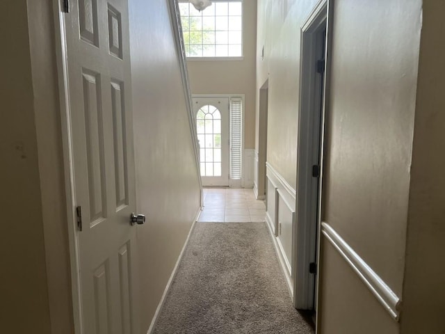 6157 Redtop Loop, Fairburn, GA 30213 - doorway with light carpet, wainscoting, and a high ceiling