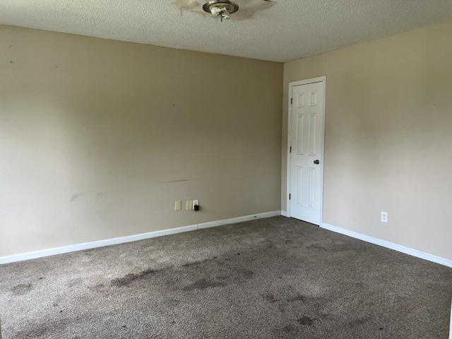 6157 Redtop Loop, Fairburn, GA 30213 - unfurnished room with dark carpet, a textured ceiling, and ceiling fan