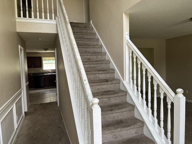 6157 Redtop Loop, Fairburn, GA 30213 - stairs with carpet and a textured ceiling
