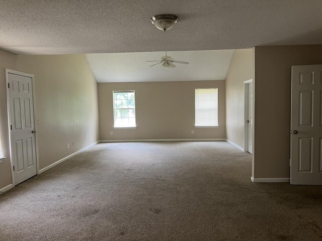 6157 Redtop Loop, Fairburn, GA 30213 - carpeted empty room featuring lofted ceiling, ceiling fan, and a textured ceiling