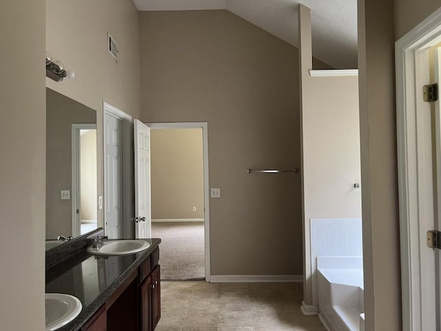 6157 Redtop Loop, Fairburn, GA 30213 - full bath with high vaulted ceiling, double vanity, a bath, and tile patterned flooring