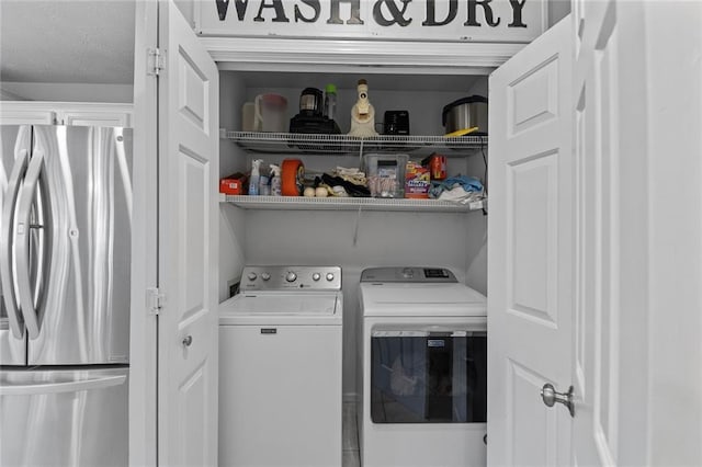 clothes washing area with laundry area and independent washer and dryer