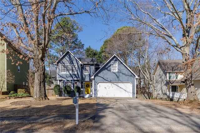 view of front of house with concrete driveway and an attached garage