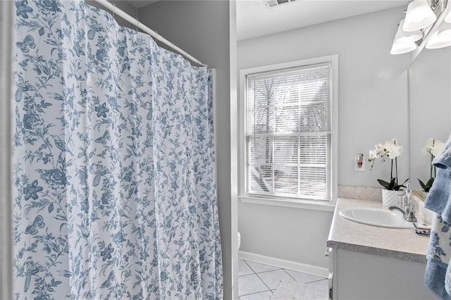 bathroom with visible vents, baseboards, toilet, tile patterned floors, and vanity