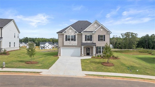 view of front of property featuring a garage and a front yard