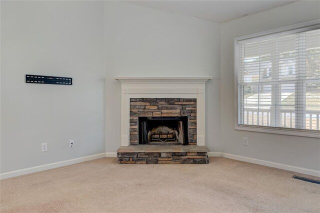 189 Meadow Spring Dr, Temple, GA 30179 - unfurnished living room featuring carpet floors, a fireplace, and baseboards