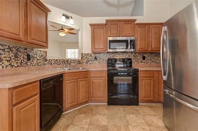 189 Meadow Spring Dr, Temple, GA 30179 - kitchen with black appliances, a sink, a ceiling fan, and light countertops