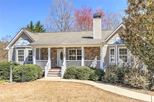 189 Meadow Spring Dr, Temple, GA 30179 - view of front of home featuring stone siding, a chimney, a porch, and a shingled roof