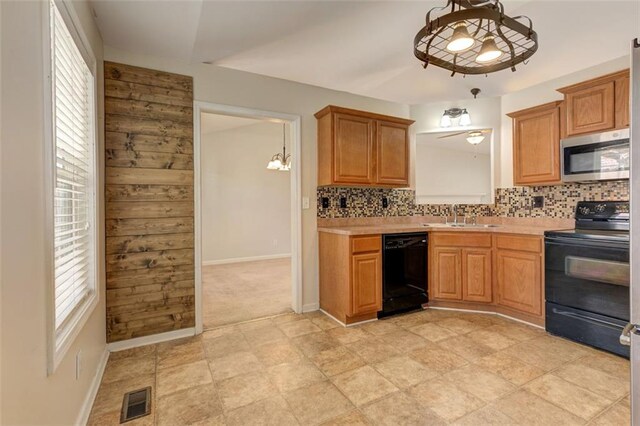 189 Meadow Spring Dr, Temple, GA 30179 - kitchen with black appliances, a sink, light countertops, and decorative backsplash