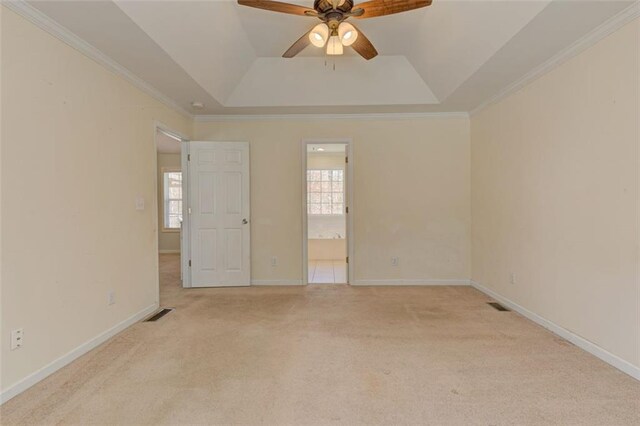 189 Meadow Spring Dr, Temple, GA 30179 - unfurnished room featuring light colored carpet, plenty of natural light, a ceiling fan, a tray ceiling, and ornamental molding