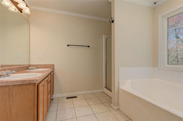 189 Meadow Spring Dr, Temple, GA 30179 - full bath featuring tile patterned floors, ornamental molding, a bath, baseboards, and double vanity
