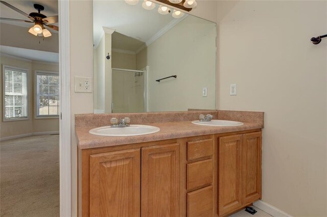 189 Meadow Spring Dr, Temple, GA 30179 - full bath with crown molding, a shower stall, double vanity, ceiling fan, and baseboards