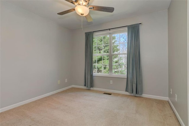 189 Meadow Spring Dr, Temple, GA 30179 - empty room featuring light carpet, baseboards, and a ceiling fan